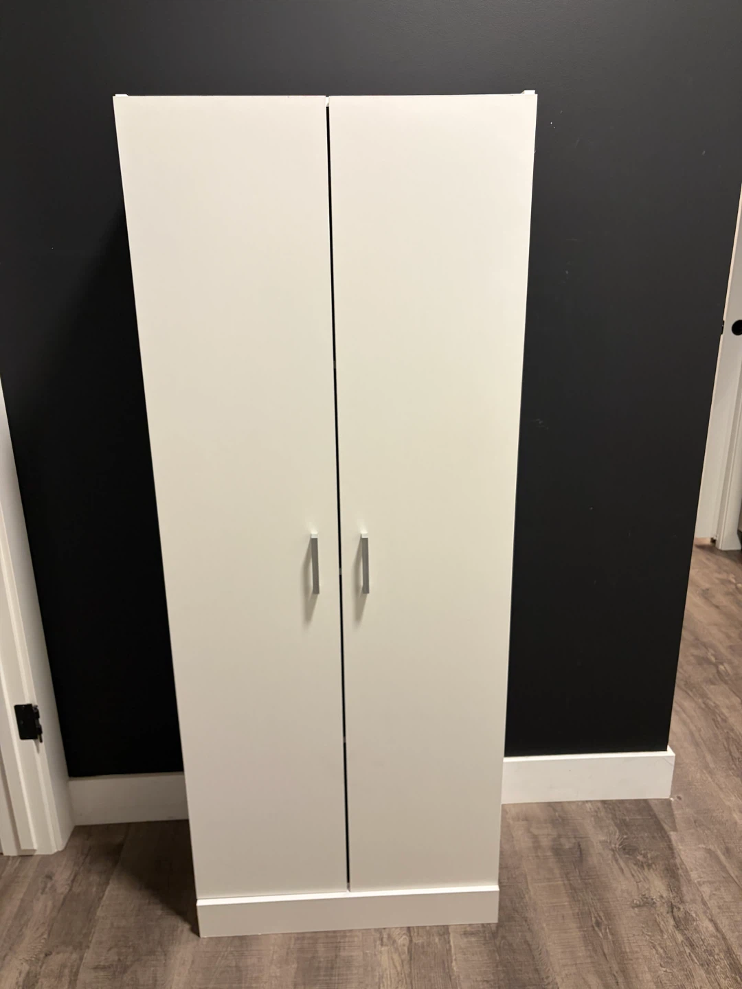 Storage cabinet with doors and shelf in white