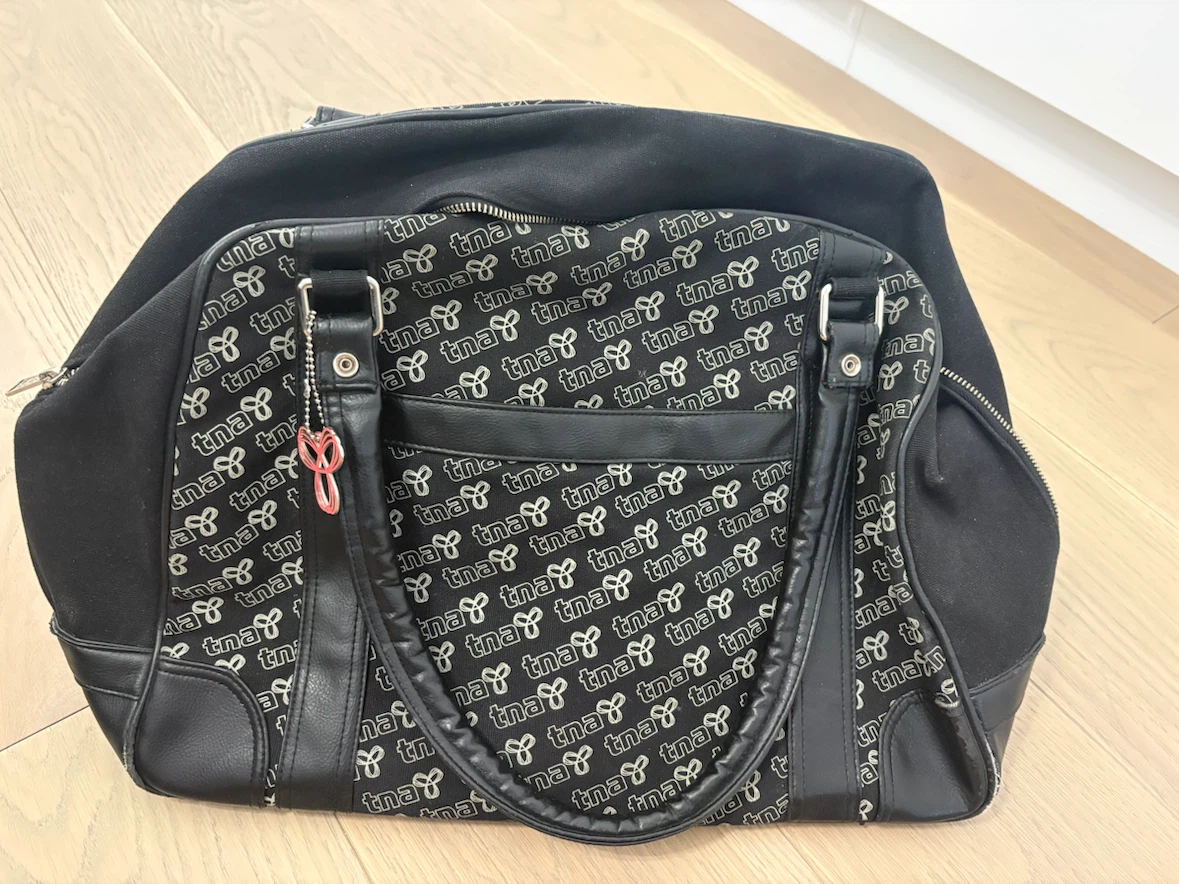TNA Black All-Over Logo Duffel Bag