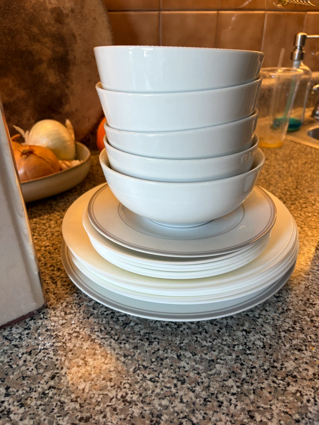 Stack of White Ceramic Bowls and Plates