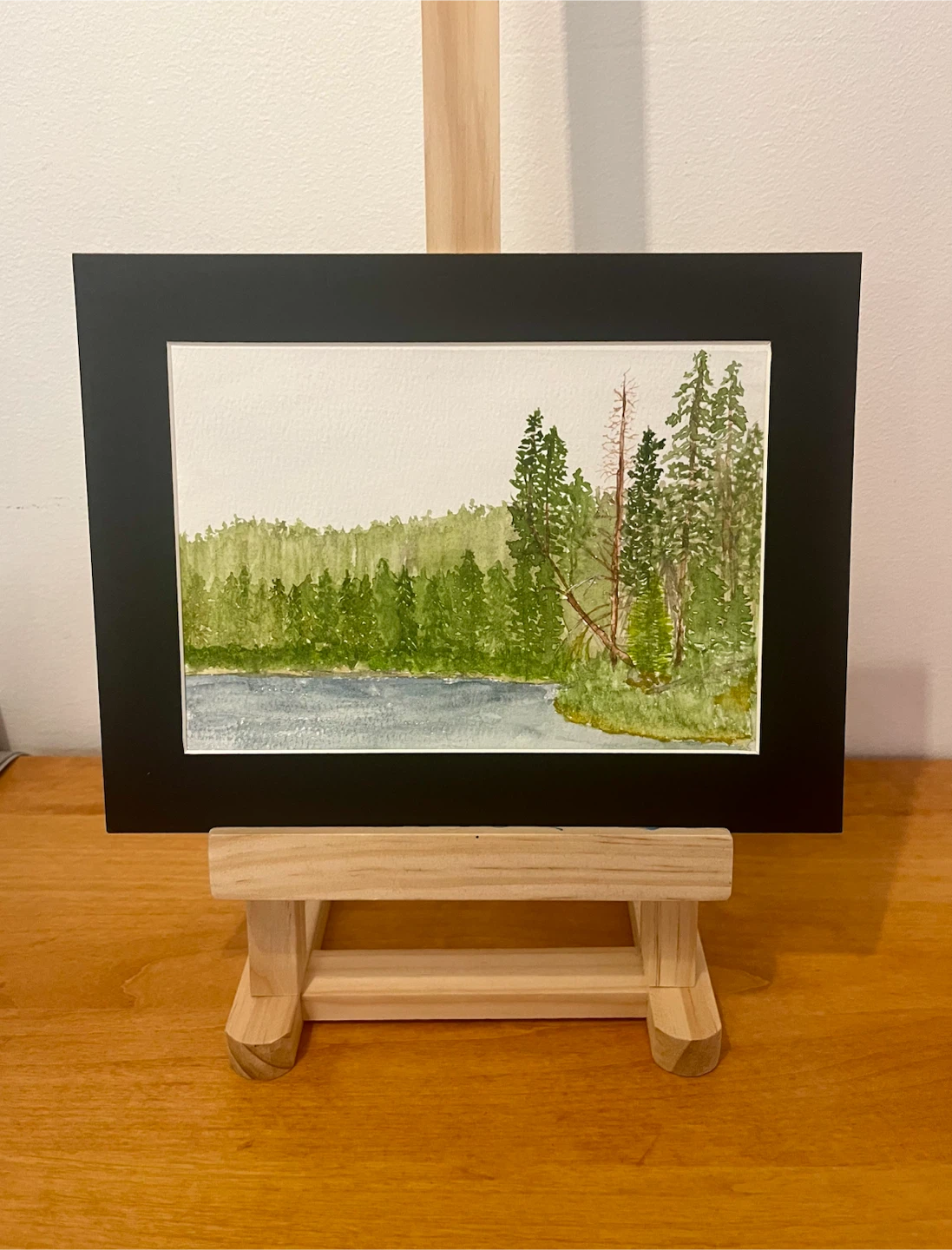 5x7 watercolour painting of a forest and lake landscape