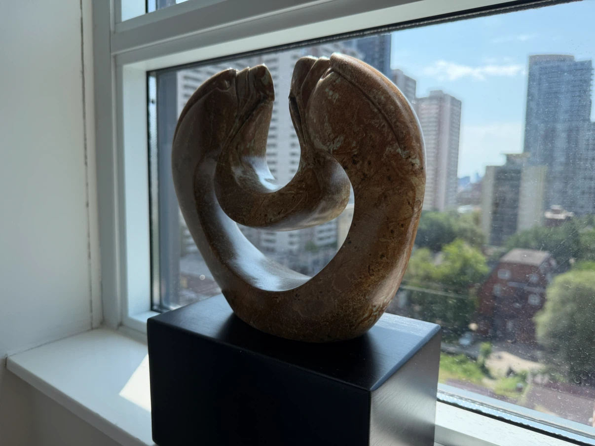 Indigenous Stone Sculpture on Black Base