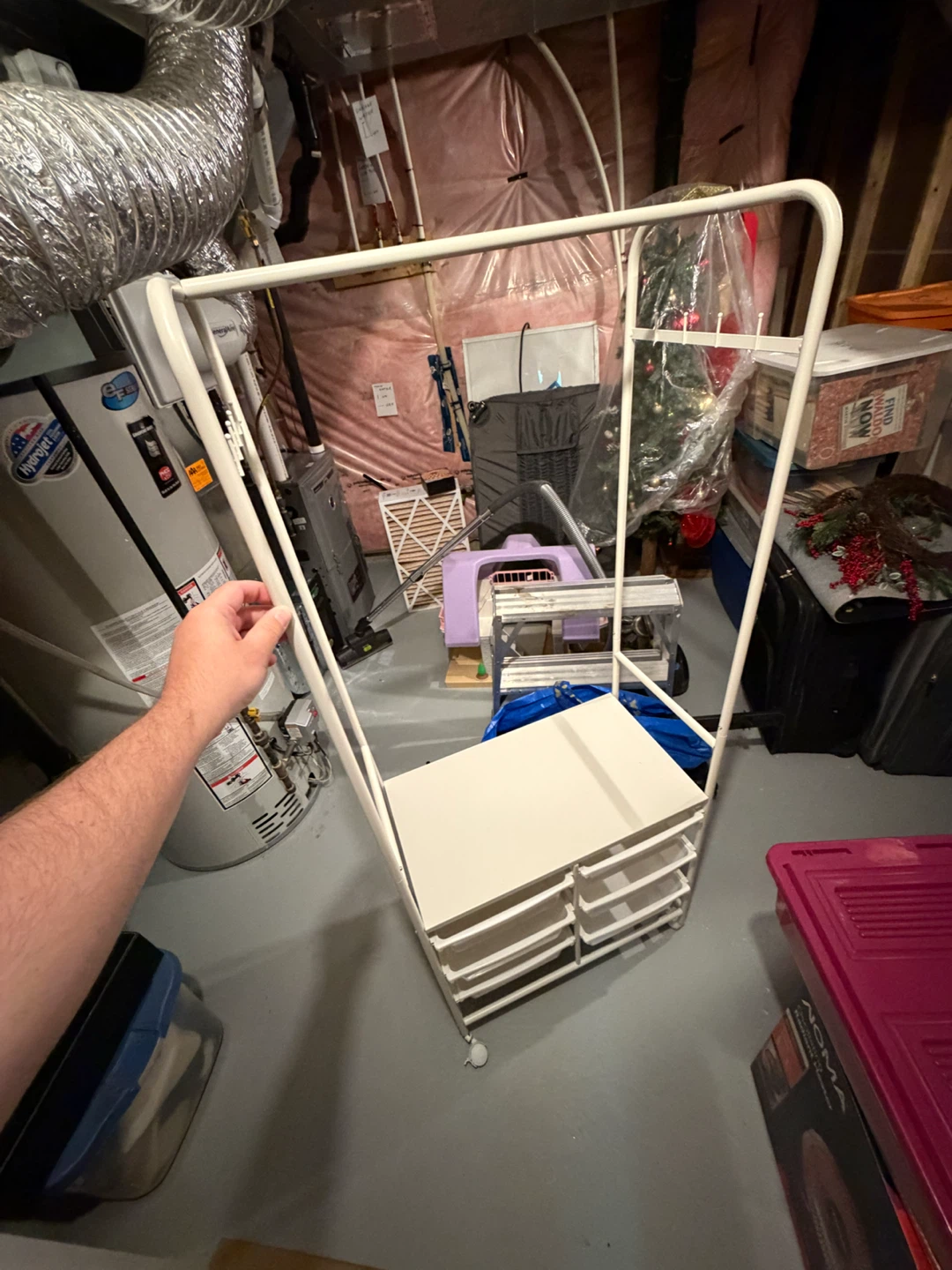 CLOTHING RACK WITH STORAGE BINS