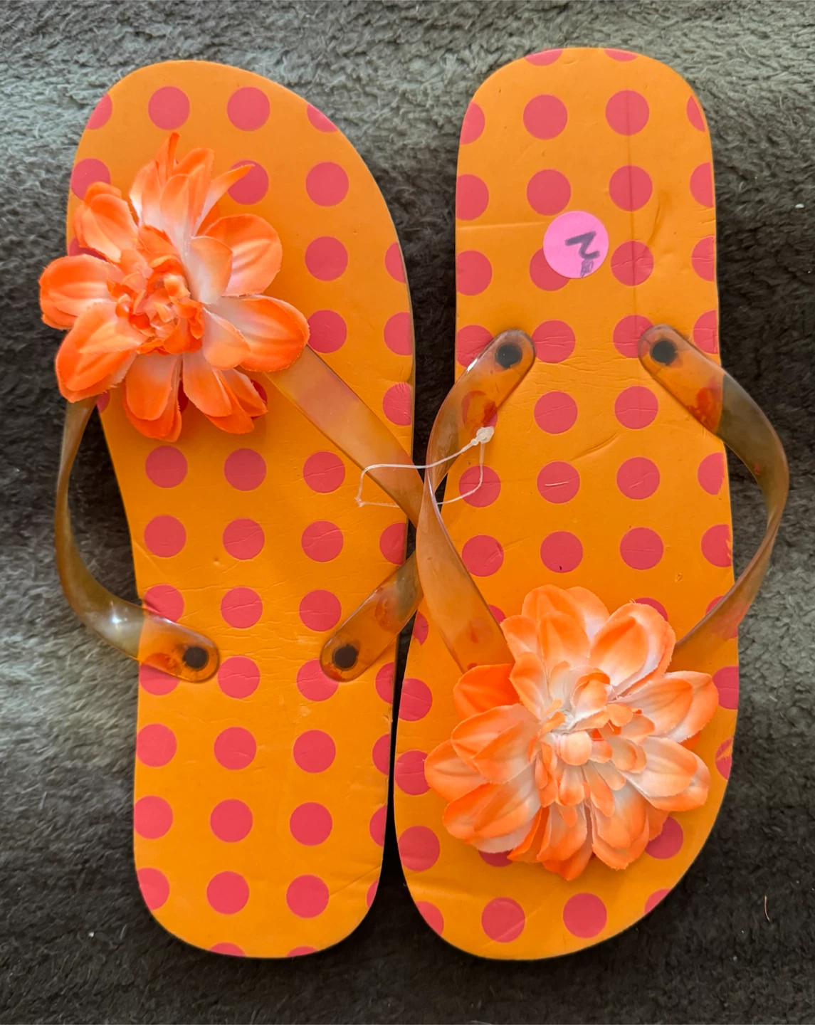 Orange polka dot flip flops with flower detail - Size 2