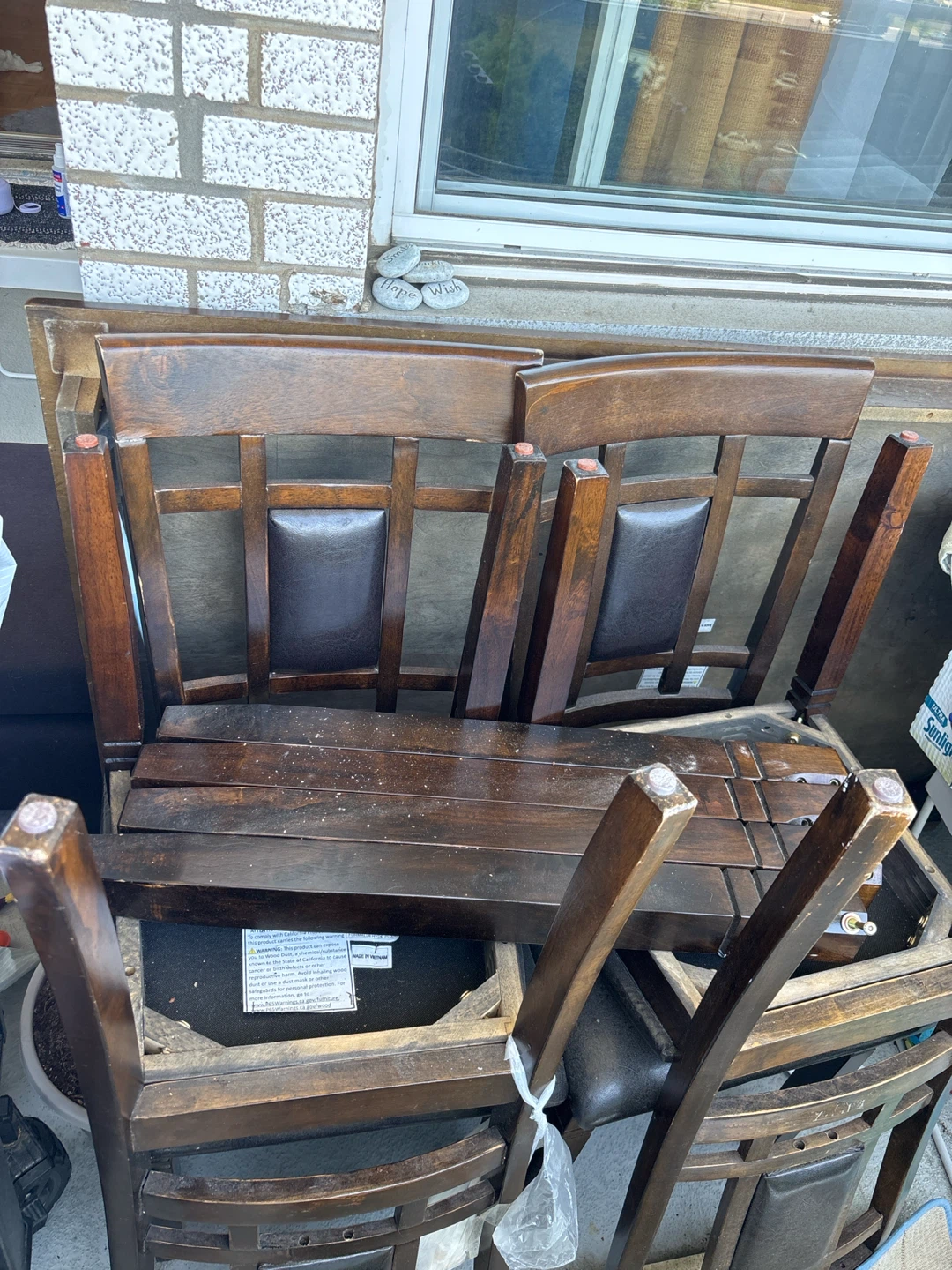 Wooden dining chairs with dark upholstery