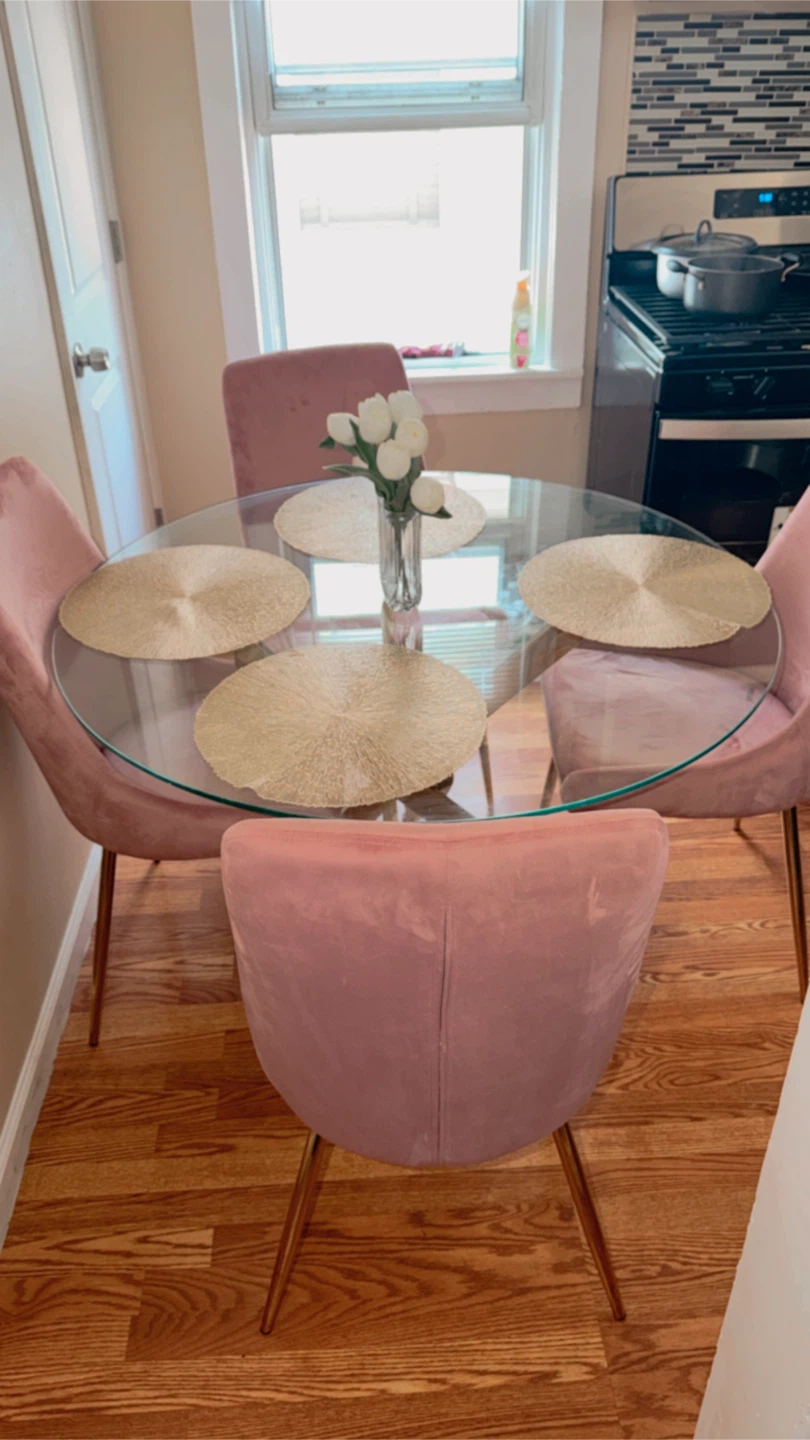 Round Glass Dining Table with 4 Pink Chairs