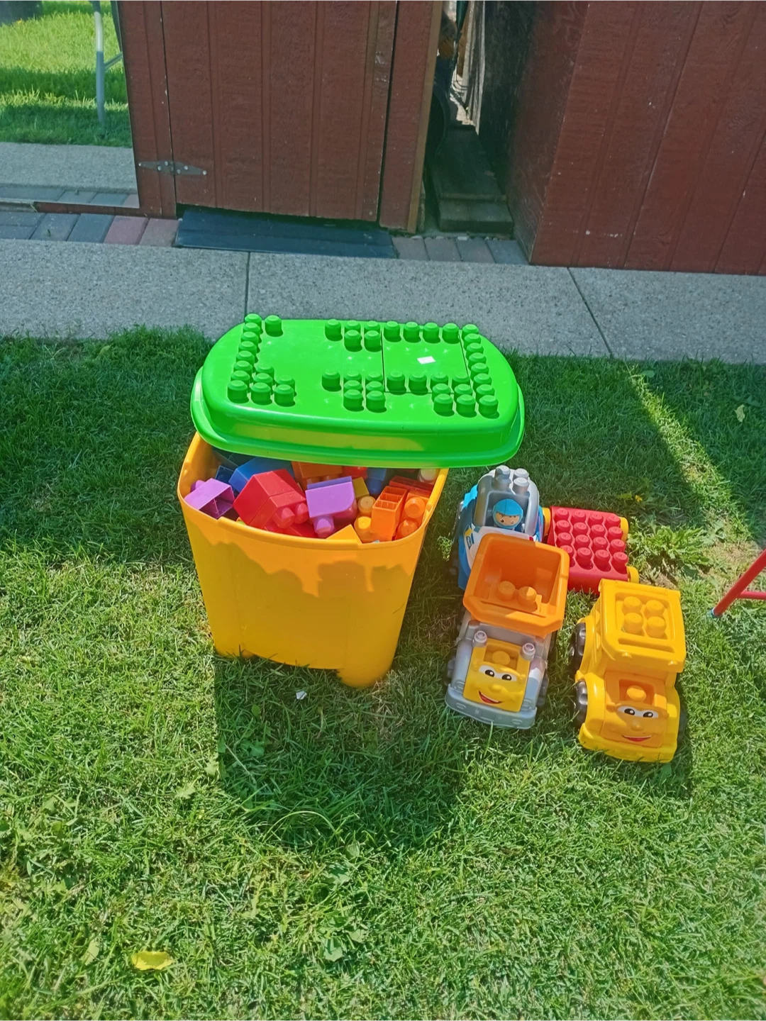 Assorted Building Blocks and Toy Trucks