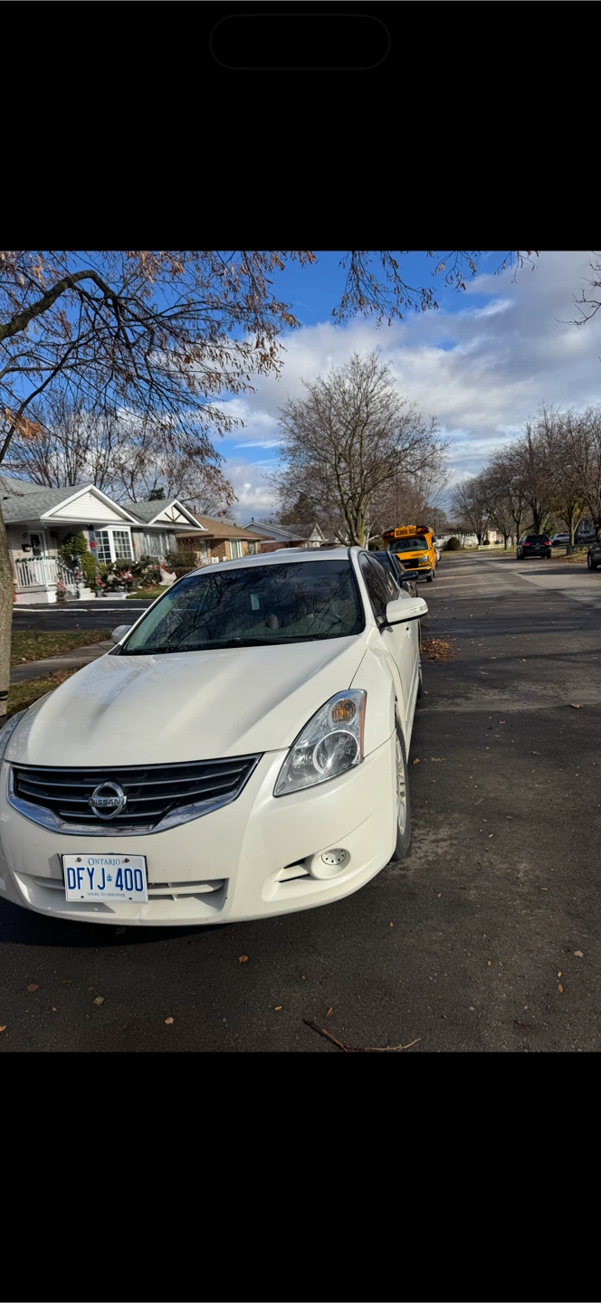 White Nissan Altima Sedan