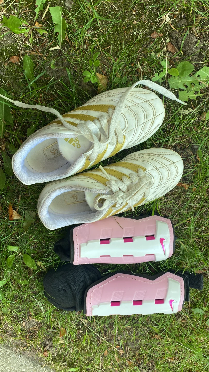 Adidas soccer cleats and Nike shin guards