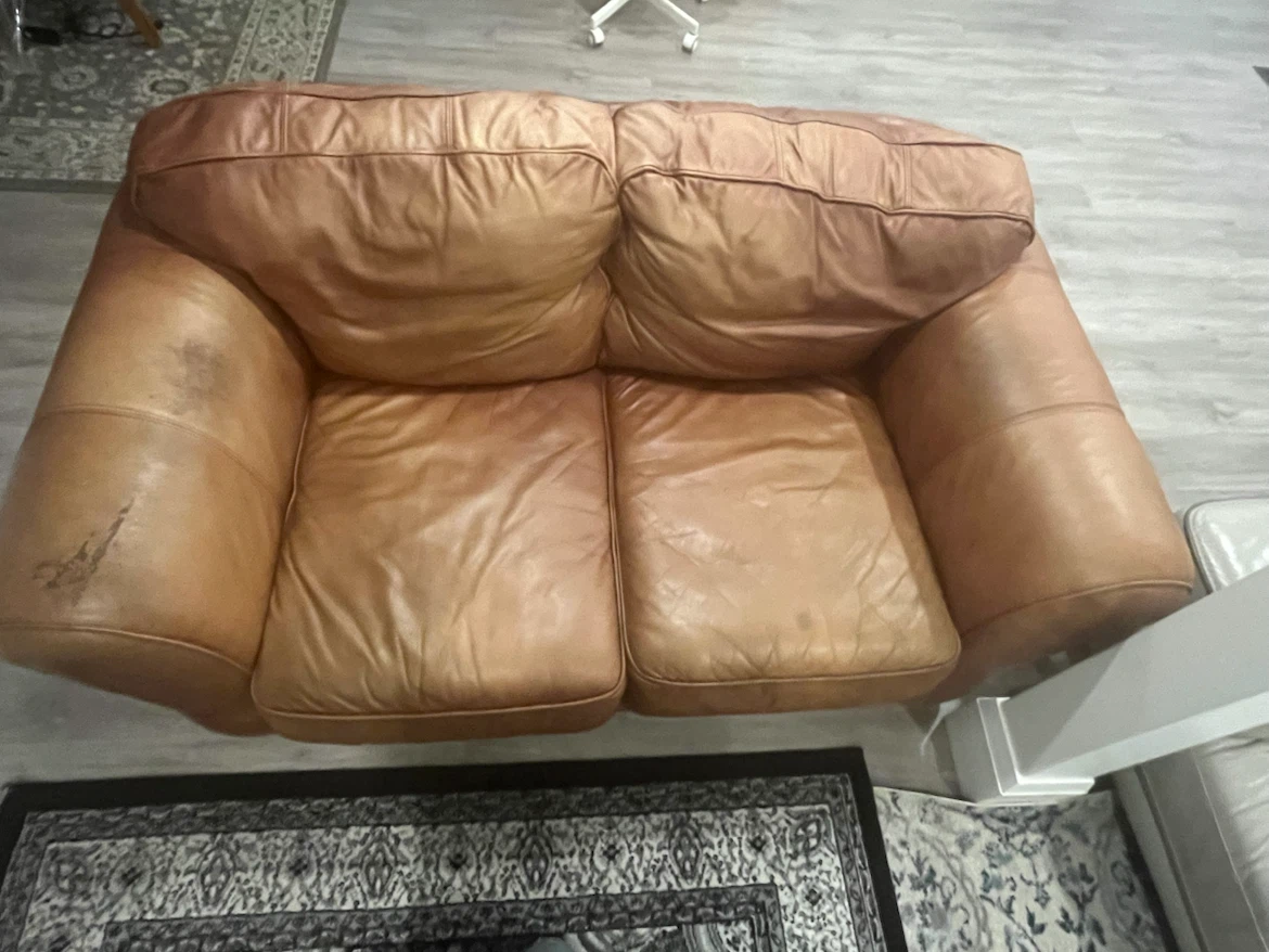 Used brown leather loveseat