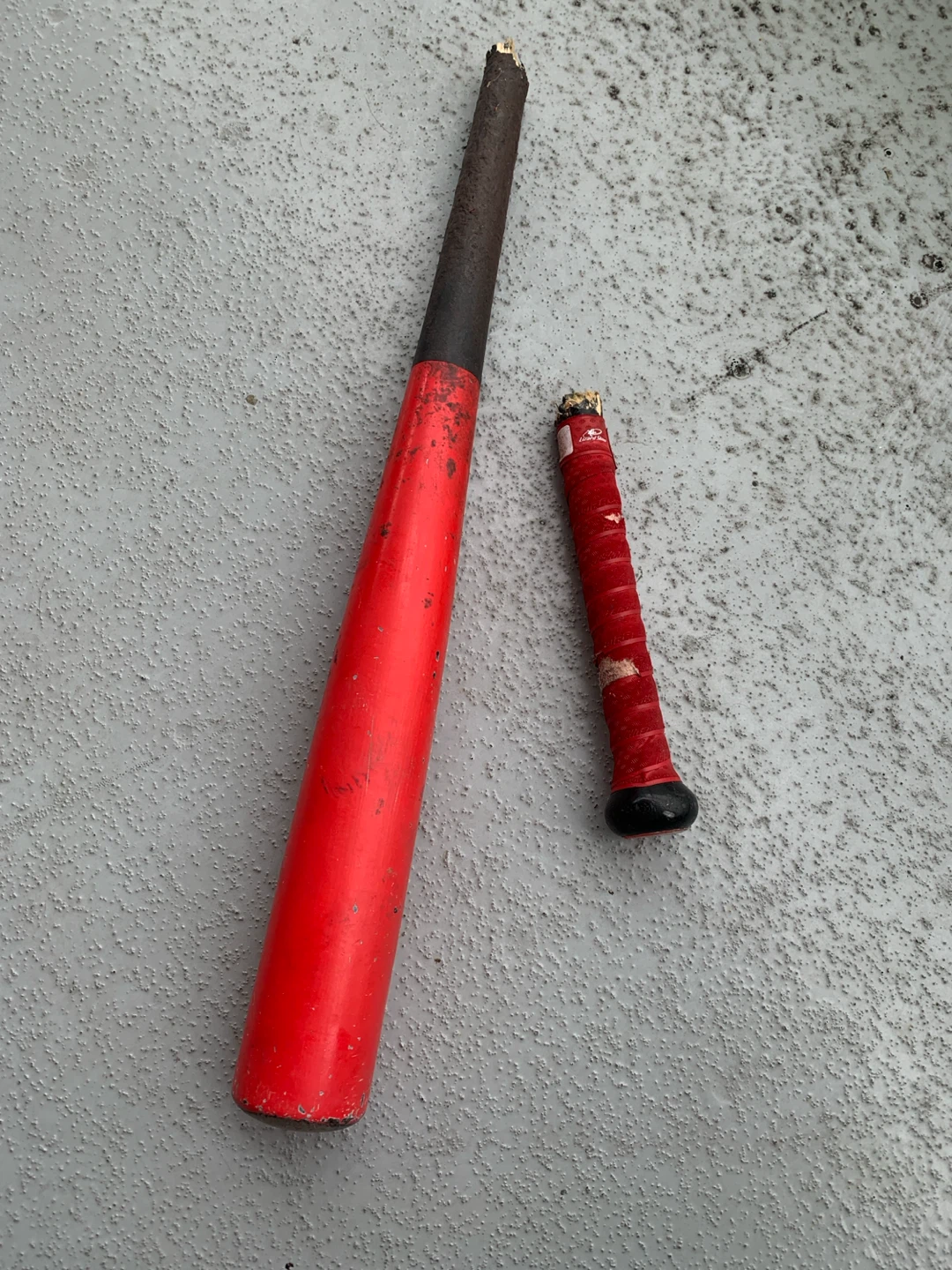 Broken Red Baum Baseball Bat - Damaged