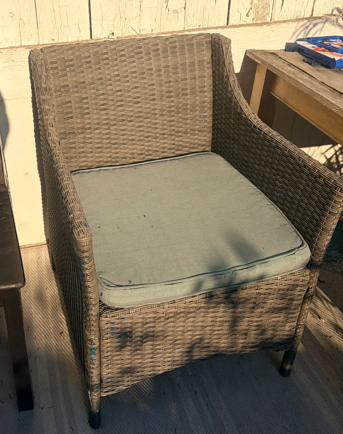 Wicker patio chair with cushion