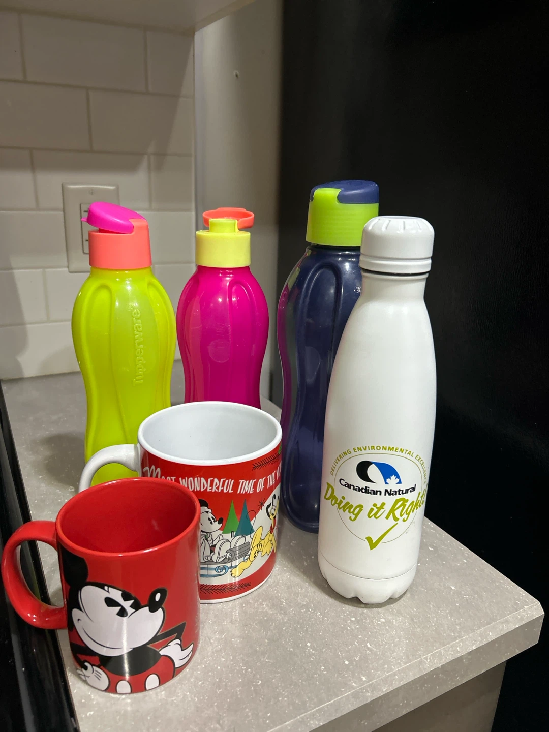 Tupperware water bottles and misc Mugs