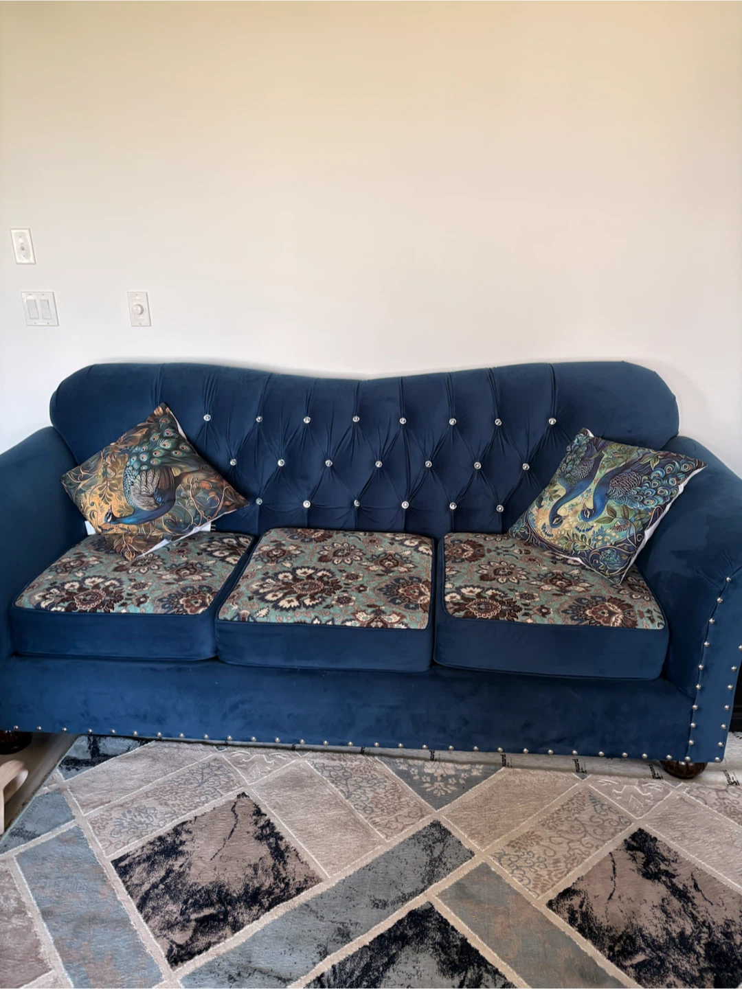 Blue Tufted Sofa with Decorative Pillows