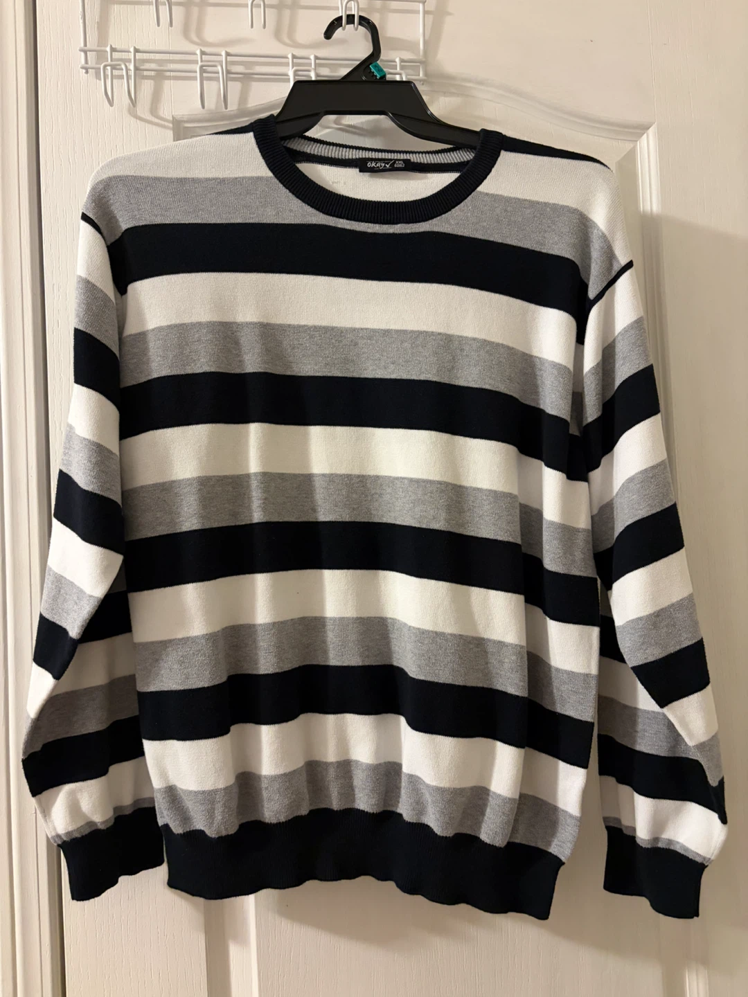 Black, white and grey striped sweater