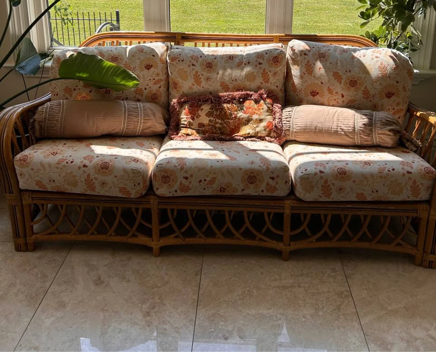Rattan Sofa with Floral Cushions