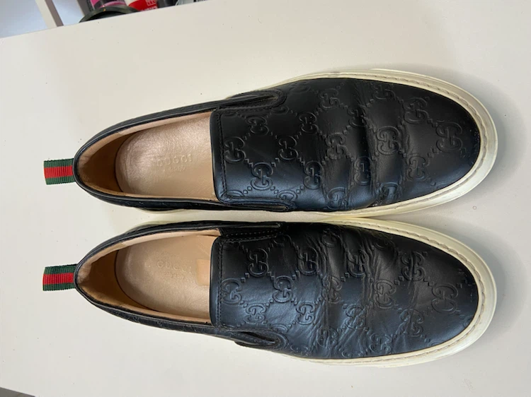 Gucci Black Leather Embossed Slip-On Sneakers