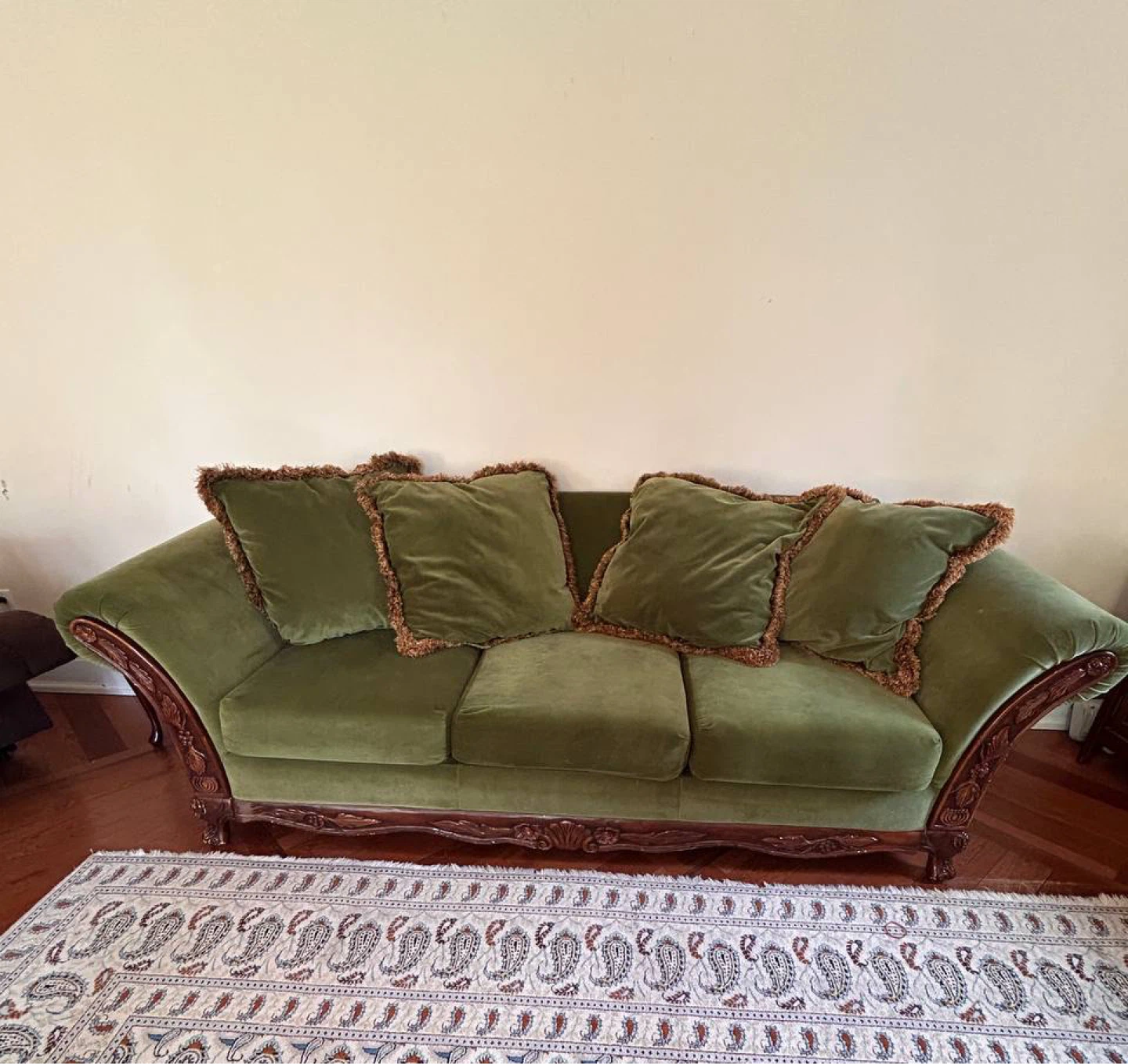 Green Velvet Sofa with Decorative Wood Trim