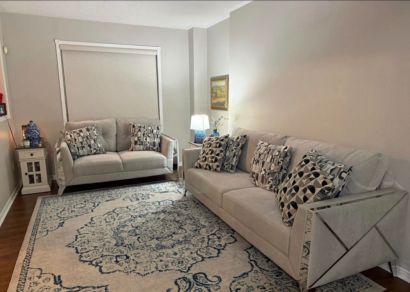 Light grey coloured sofa with geometric arms