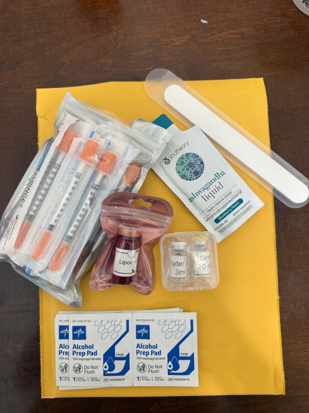 Syringes, Lipoc+ Vial, Ashwagandha Liquid, and Alcohol Prep Pads
