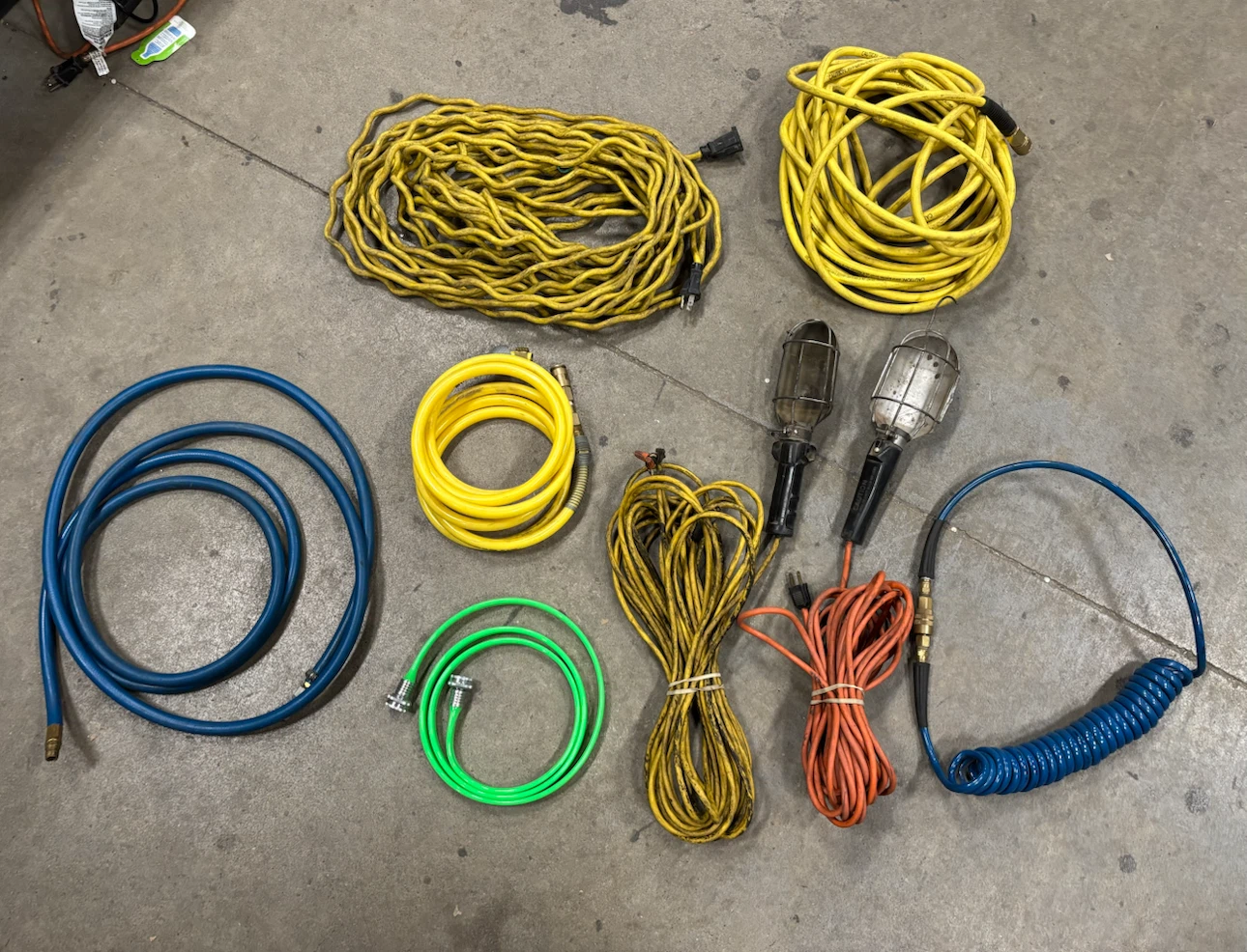 Assorted Air Hoses, Extension Cords, and Work Lights