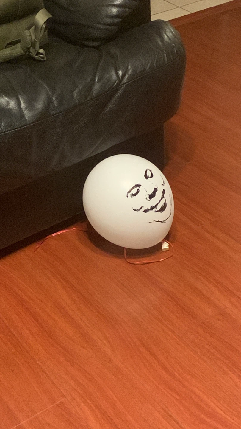 White Balloon with Drawn Face