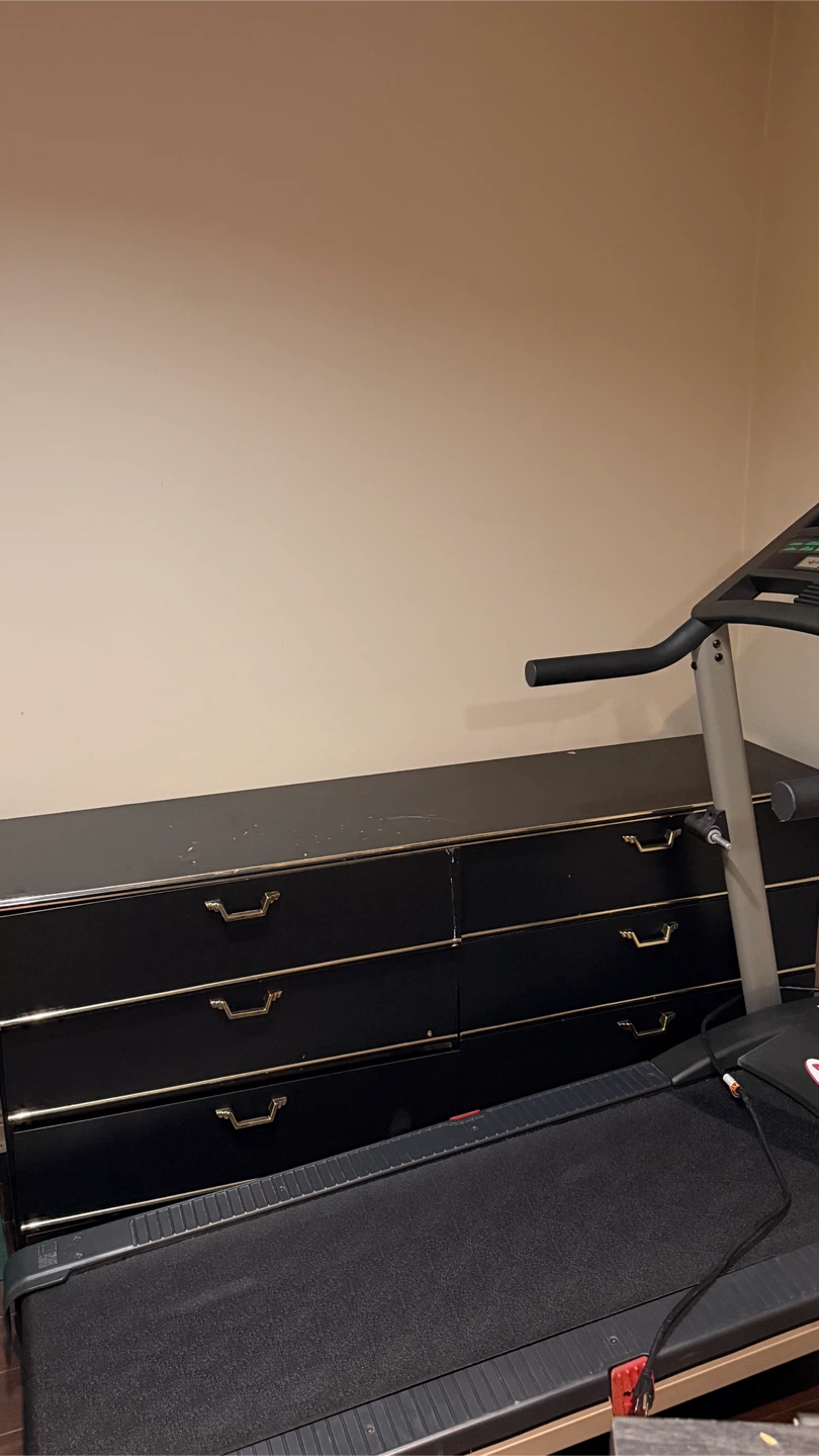 Black dresser with gold trim