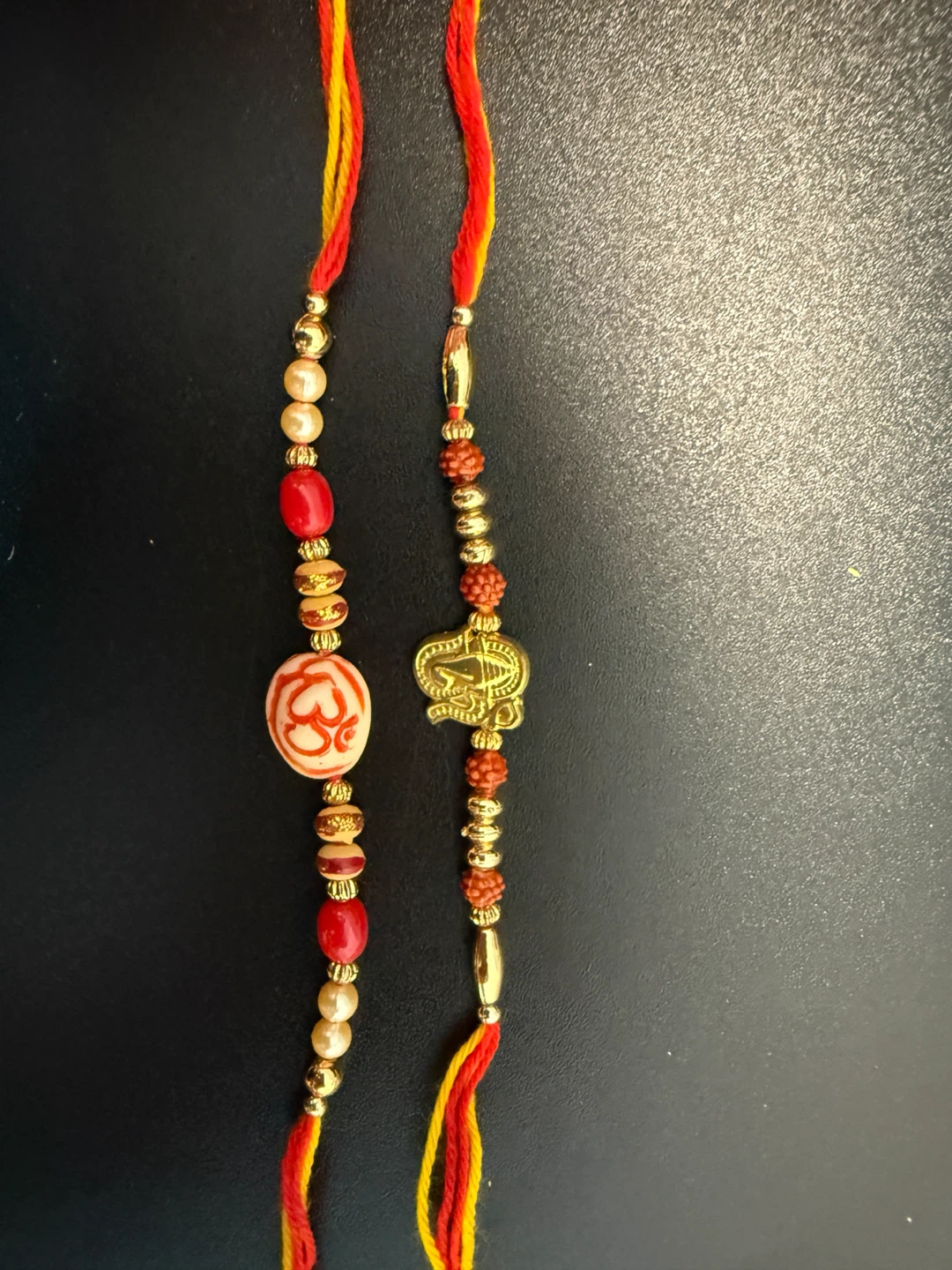 Decorative Rakhi Bracelet Set with Om and Ganesha Charm