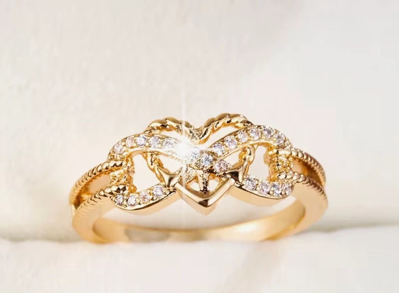 Gold Tone Ring with Interlocking Hearts and Rhinestones