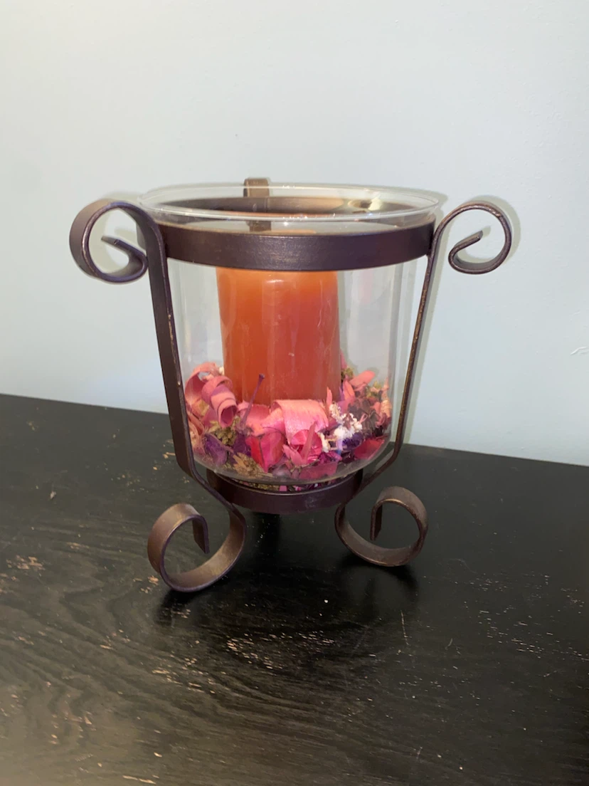 Glass and metal candle holder with potpourri