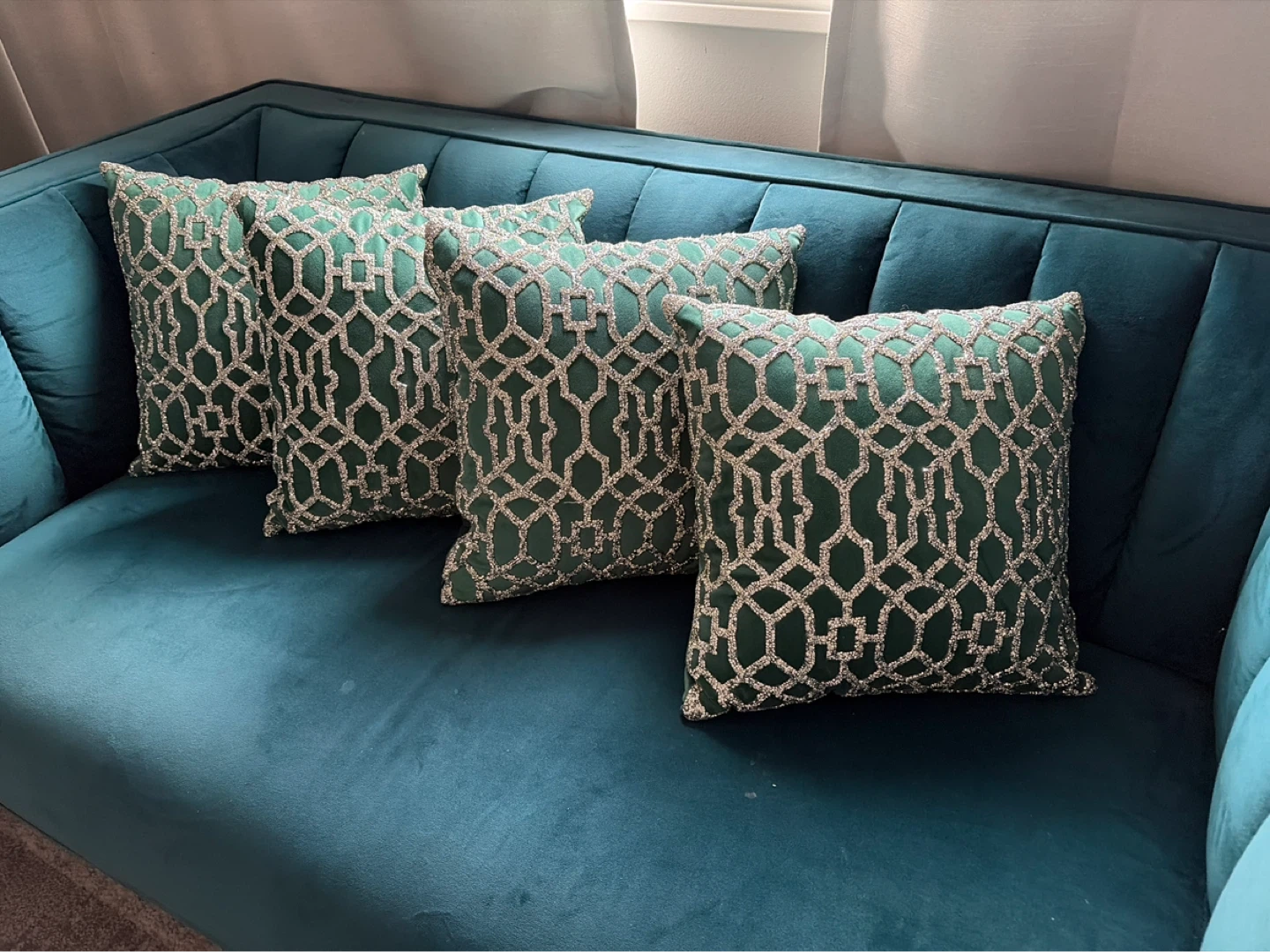 Four Green Decorative Pillows with Silver Embellishments