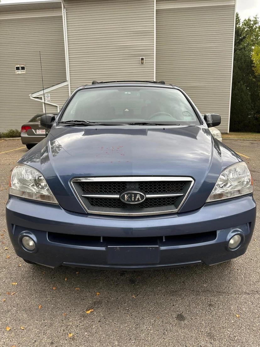 Blue Kia Sorento LX SUV