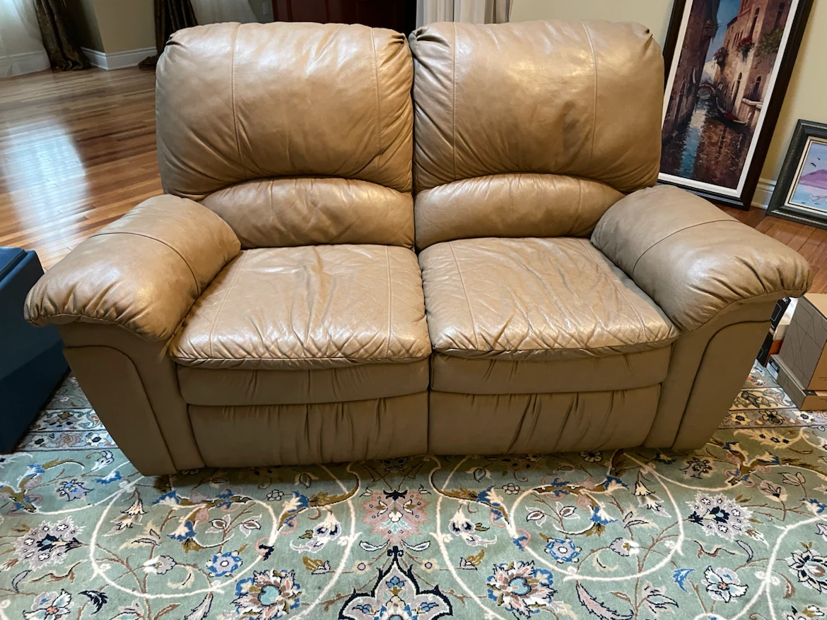 Tan Leather Reclining Loveseat