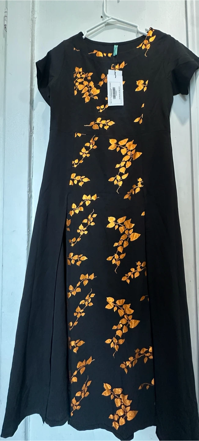 Black dress with gold leaf pattern