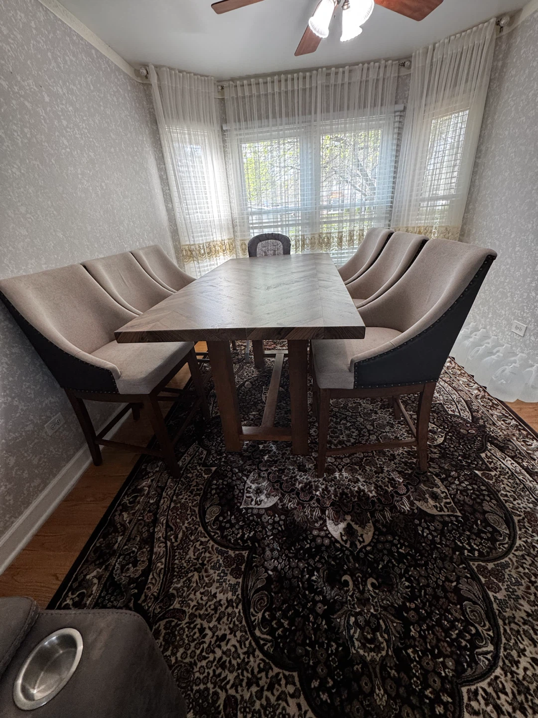 Very nice wooden table with six chairs.