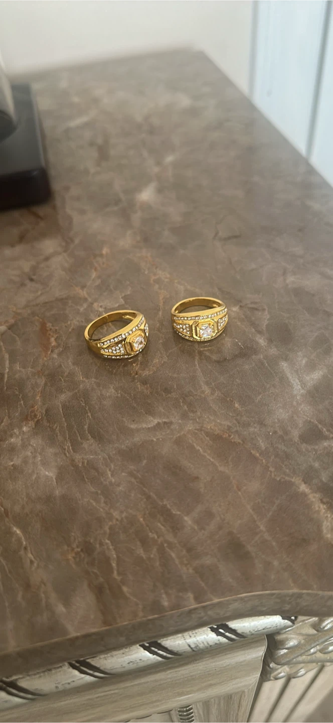 Gold-tone rings with clear stones featuring Sterling silver