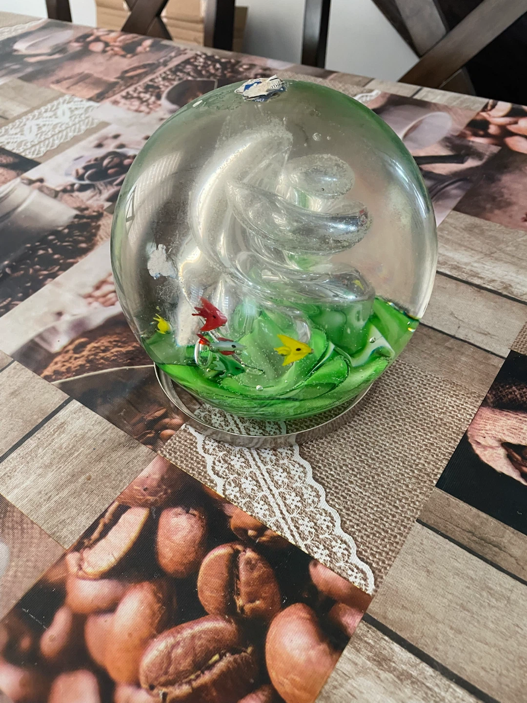 Glass paperweight with fish and swirling design