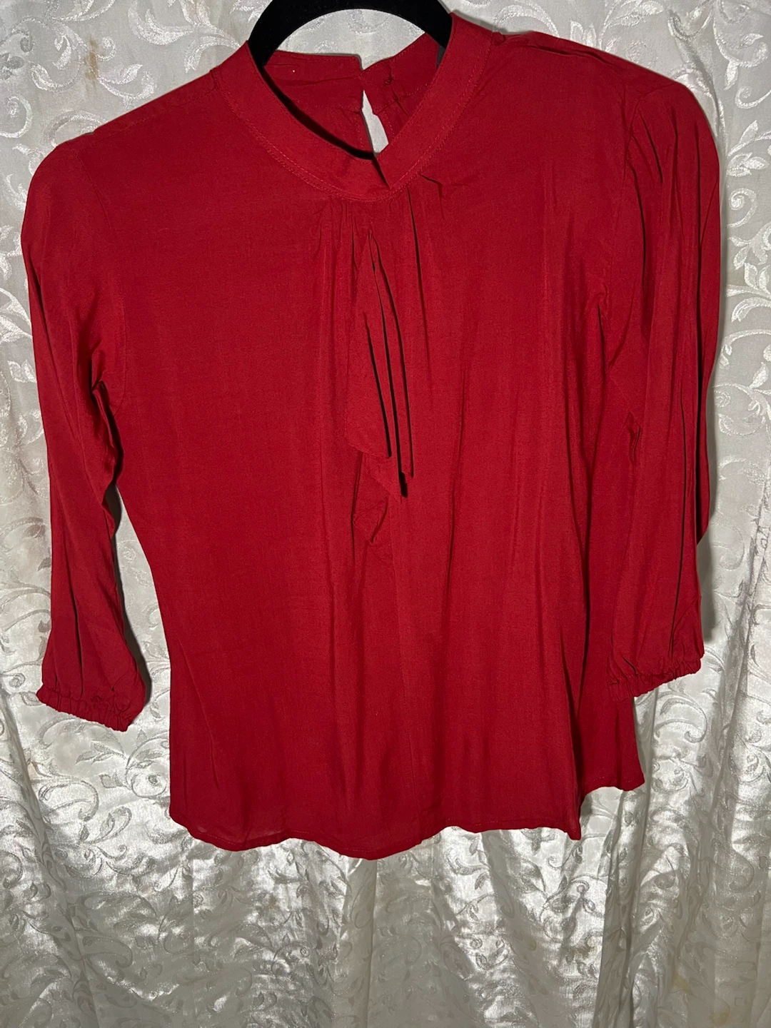 Red long-sleeve blouse