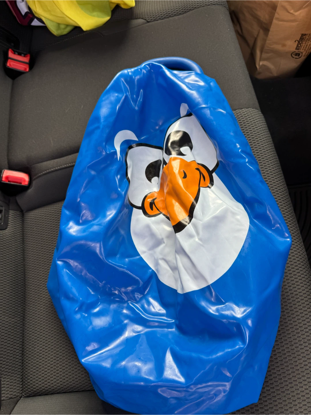 Blue inflatable ball with cartoon penguin character