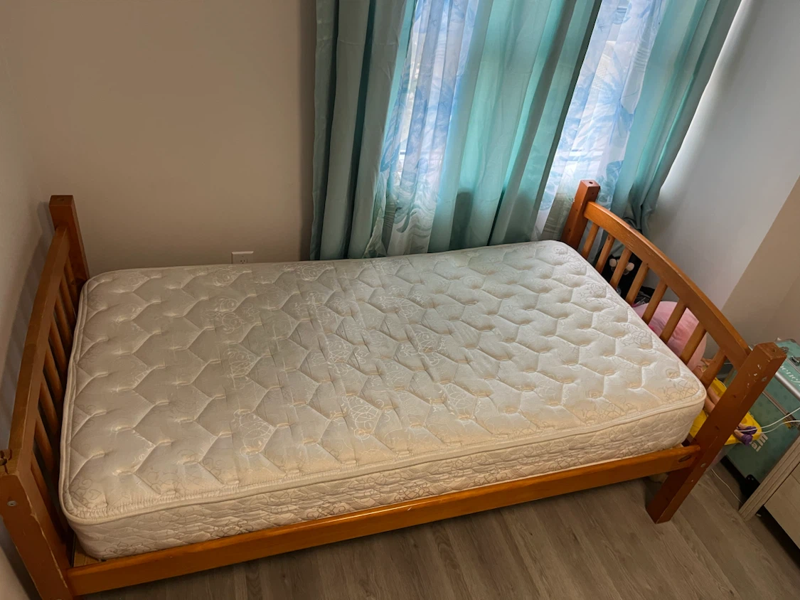 Wooden bunk bed with two mattresses