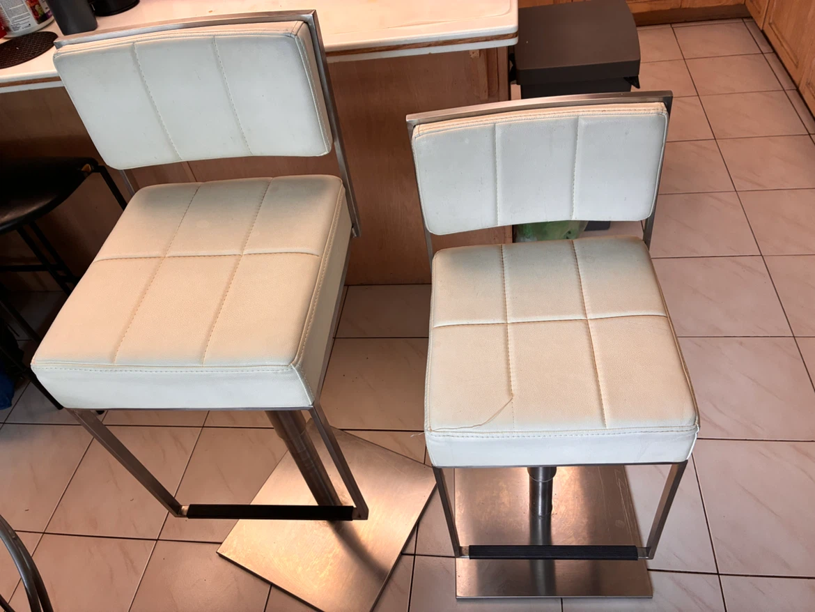 Pair of faux leather height adjustable bar stools
