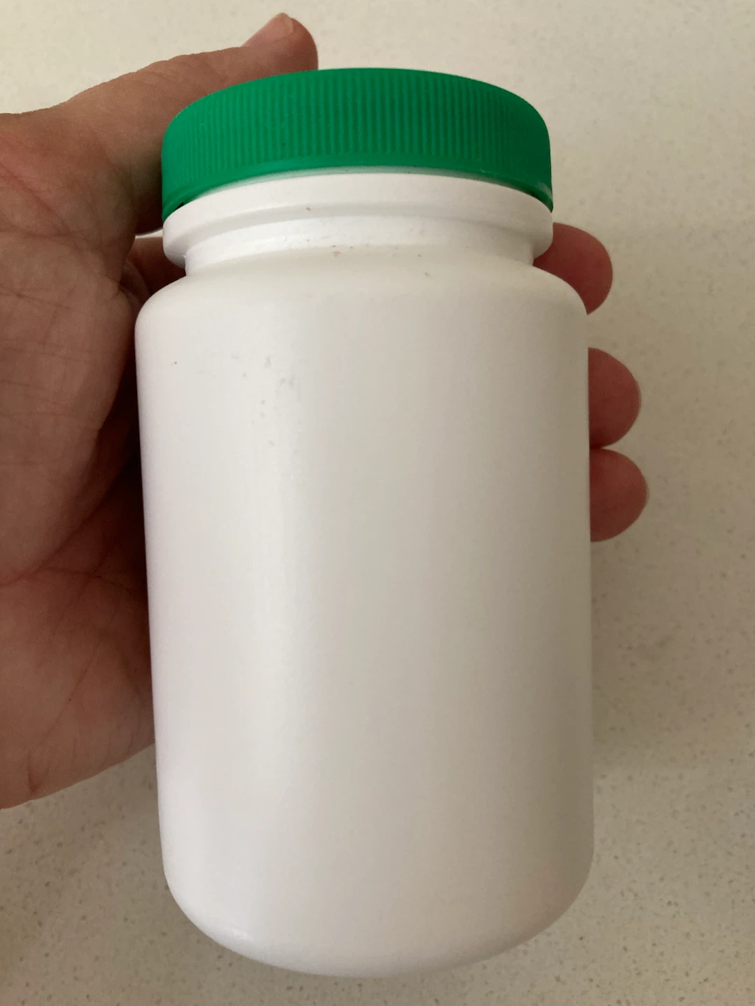 FREE White supplement bottle with green cap