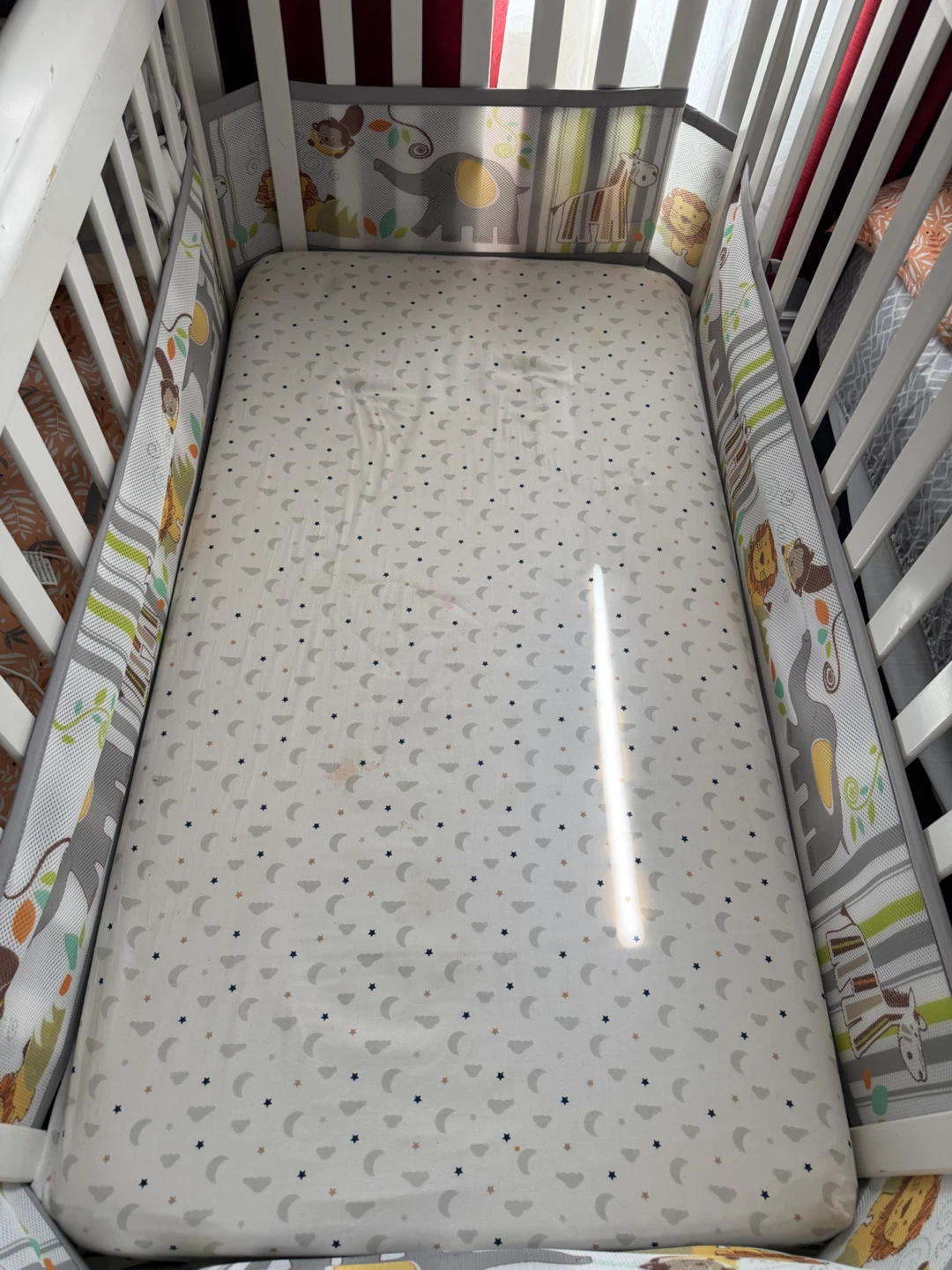White Baby Crib with Animal Theme Bedding