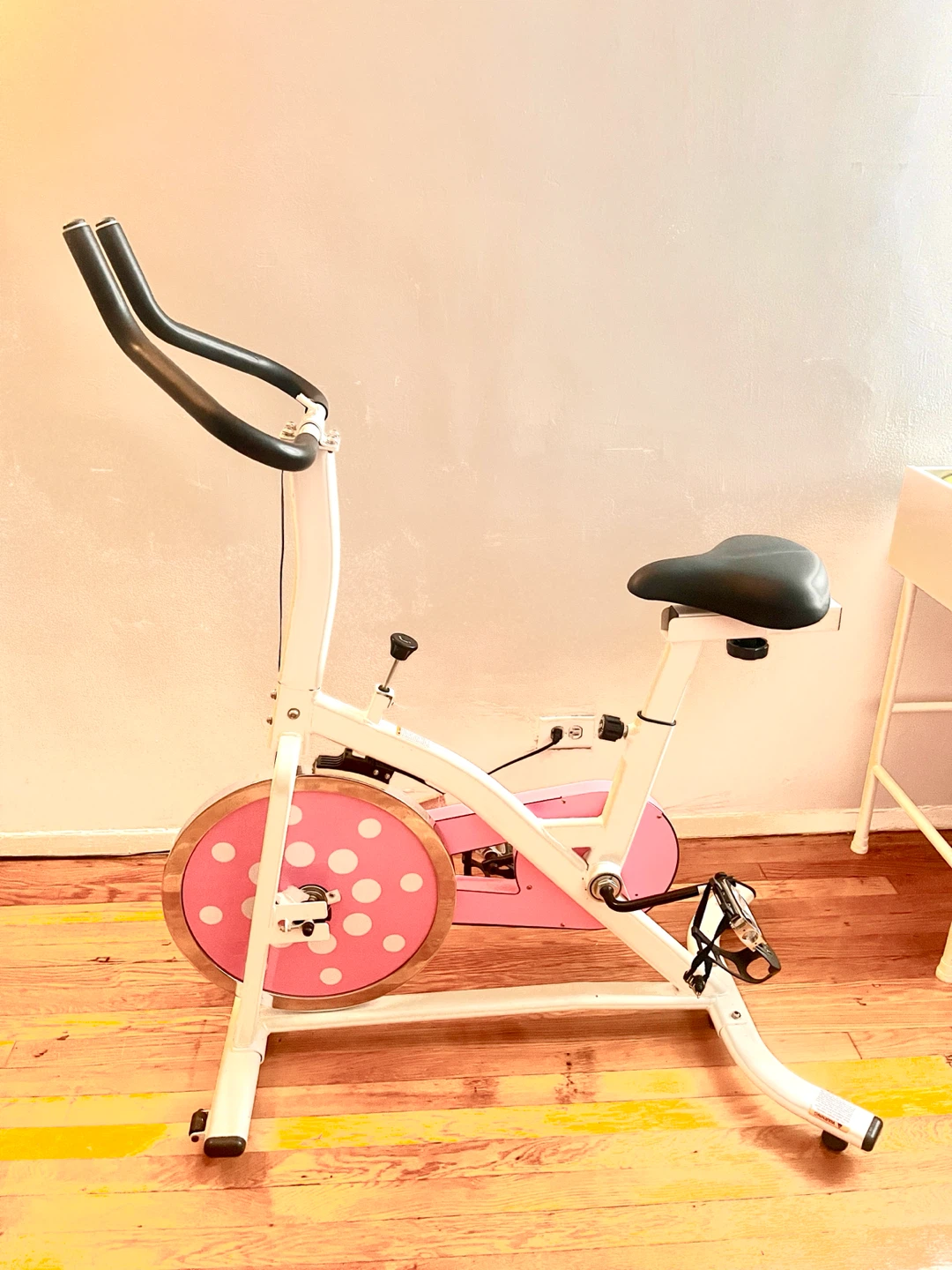 White and Pink Stationary Exercise Bike with Polka Dots