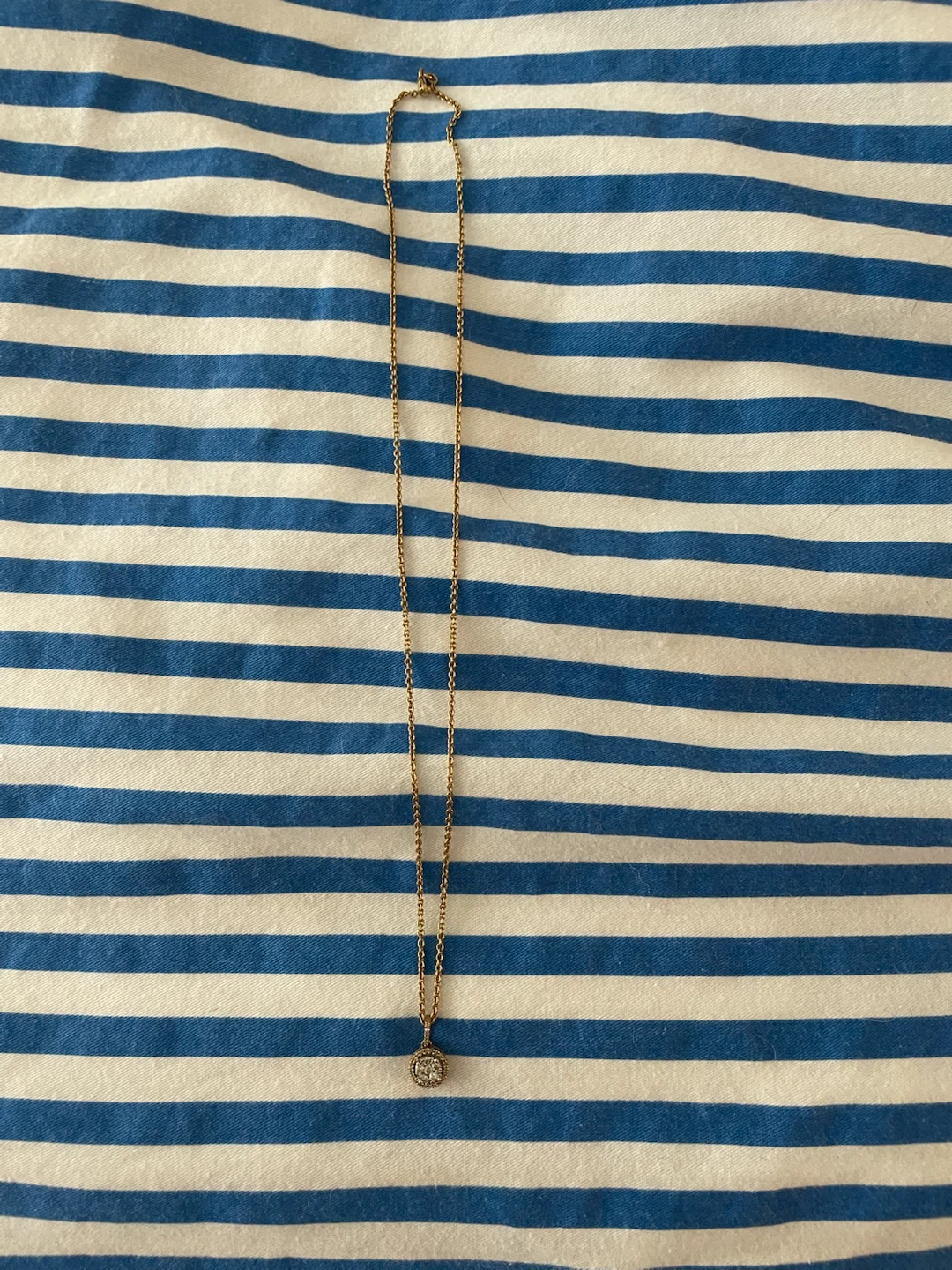 Gold-tone necklace with small circular pendant
