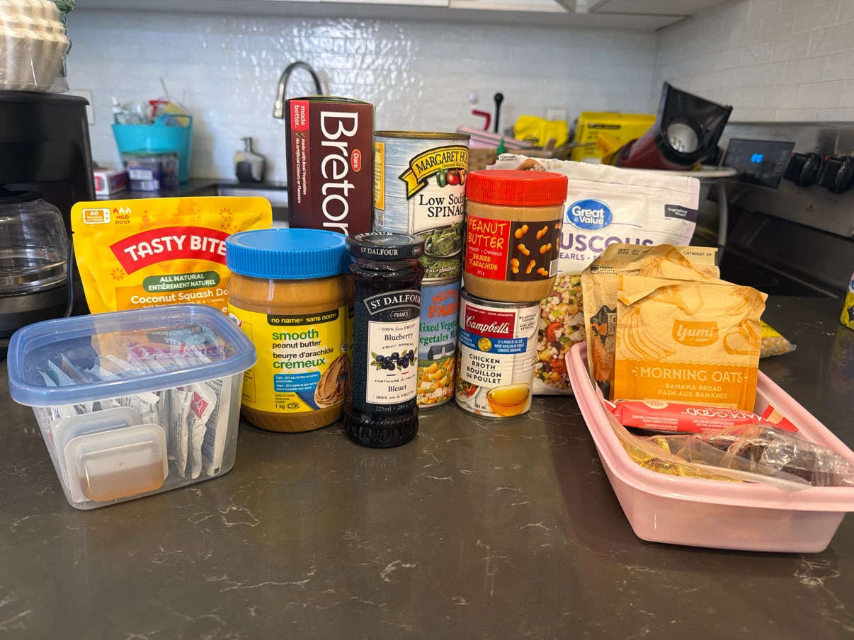 Assorted pantry staples: Peanut Butter, Jam, Oats, and more