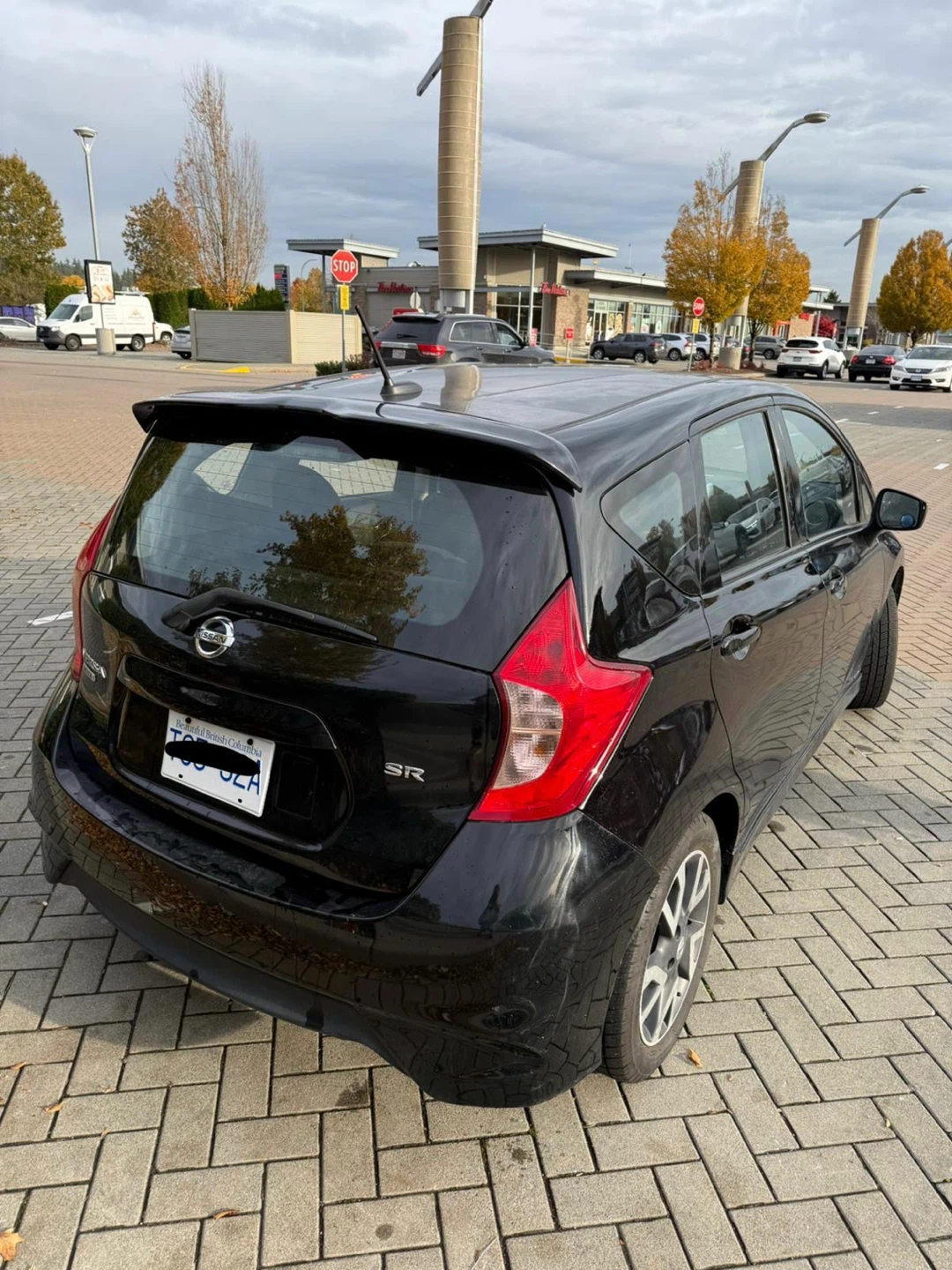 Black Nissan Versa SR Hatchback - photo 2