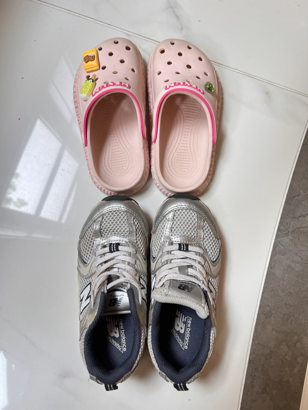 2 pairs of kid’s shoes