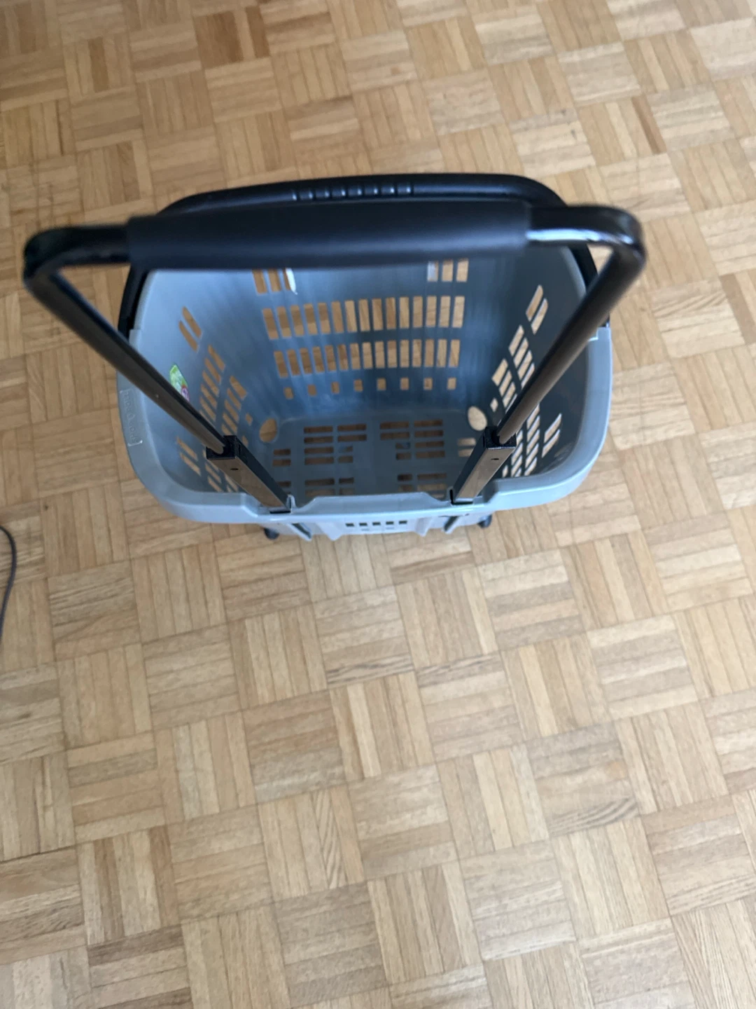 Grey laundry basket with wheels