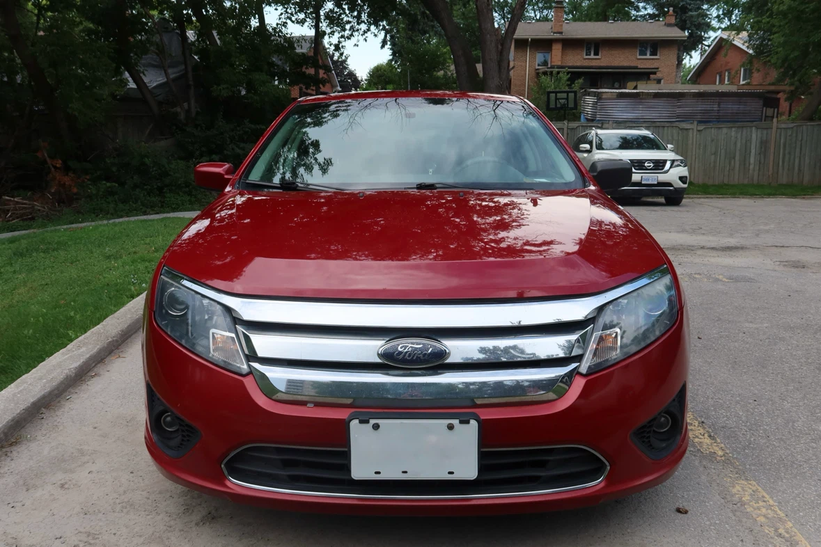 Red Ford Fusion Sedan