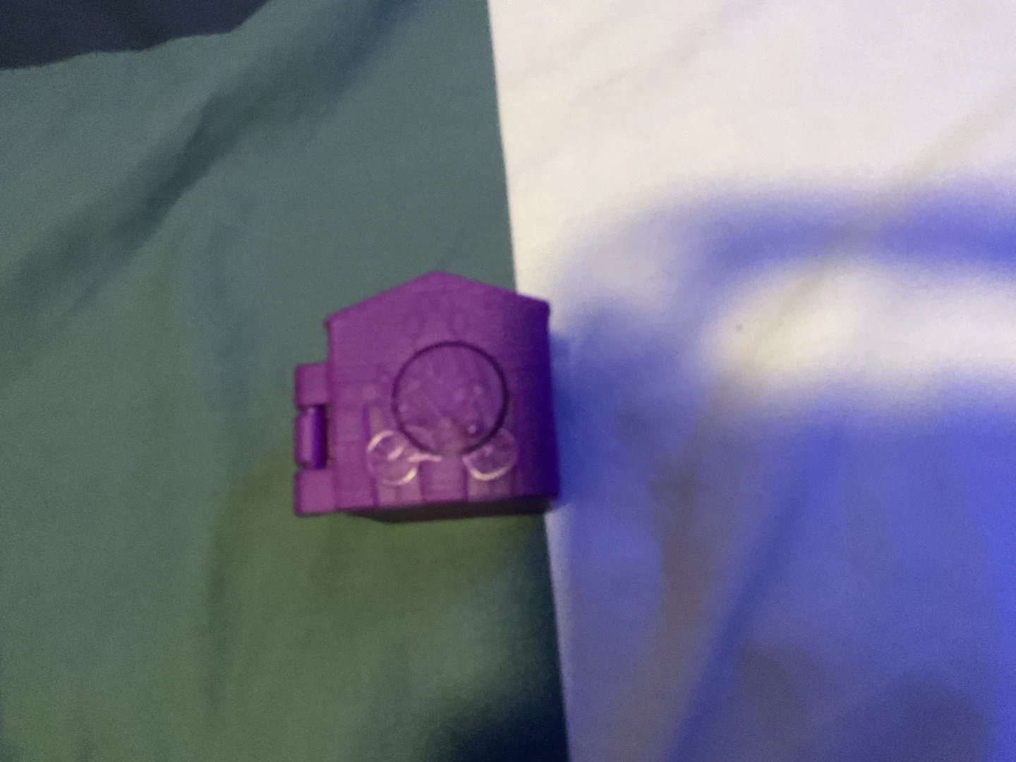 Purple collectible toy house with creature